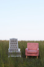 two chairs in a field 