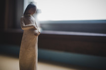 pregnant woman figurine 