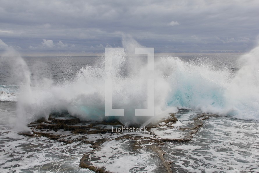 waves splashing into rocks 