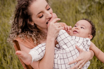 mother and toddler son portrait outdoors 