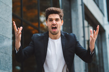 Portrait of angry furious businessman, having nervous breakdown at work, screaming in anger, stress management, mental distress problems, losing temper, reaction on failure. High quality photo