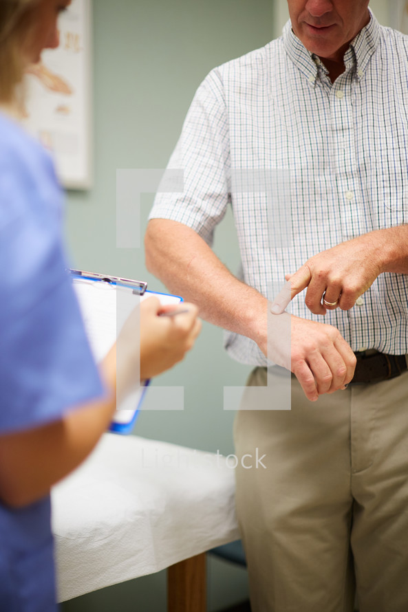 a nurse speaking with a patient 