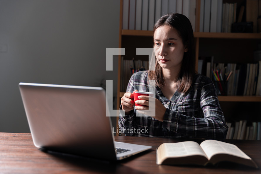 Woman with Bible and Computer