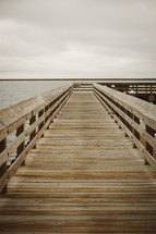 a wooden pier over water 