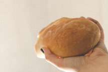 hand holding bread 