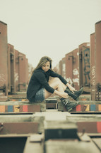 woman sitting in a stock yard