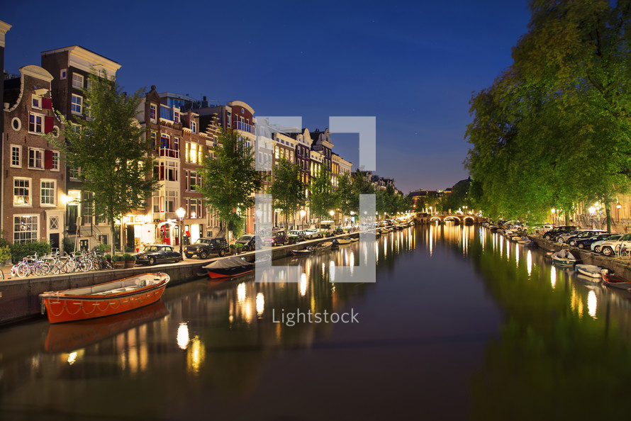Street and canal in the evening in Amsterdam