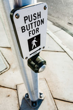 Crosswalk sign button on pole cross street city