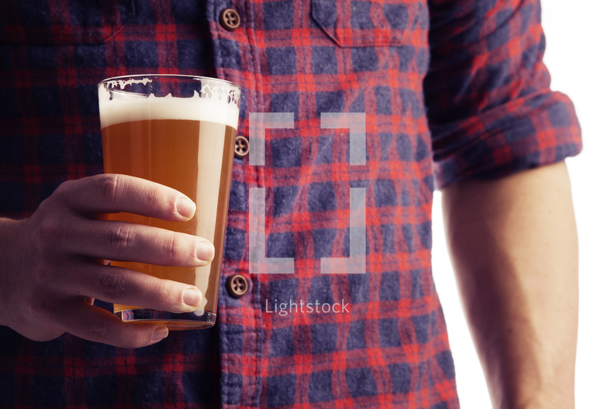 a man holding a beer glass 