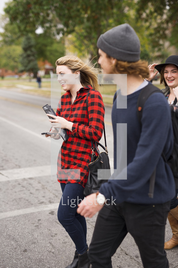 students walking to class on a college campus 