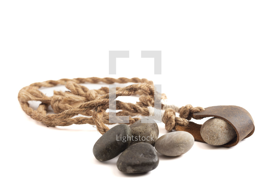 A Sling Shot and Stones Isolated on a White Background from the Story of David and Goliath in the BIble 