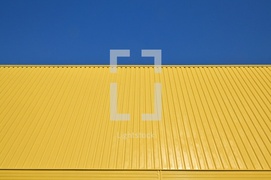 yellow wall and blue sky 
