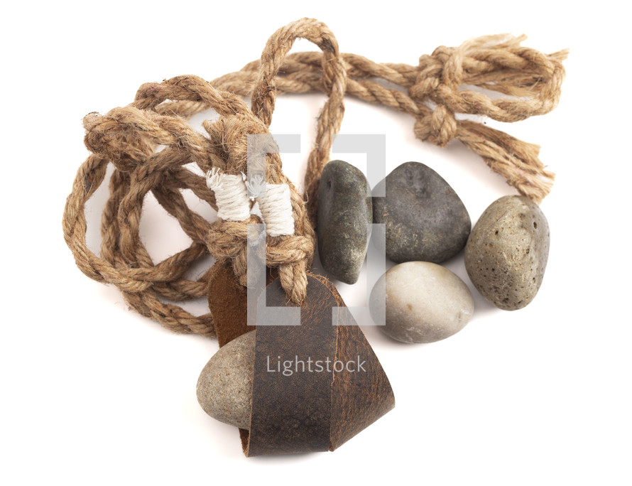 A Sling Shot and Stones Isolated on a White Background from the Story of David and Goliath in the BIble 