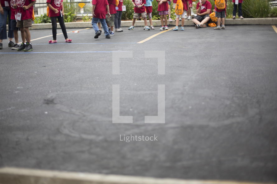 children outdoors in a parking lot