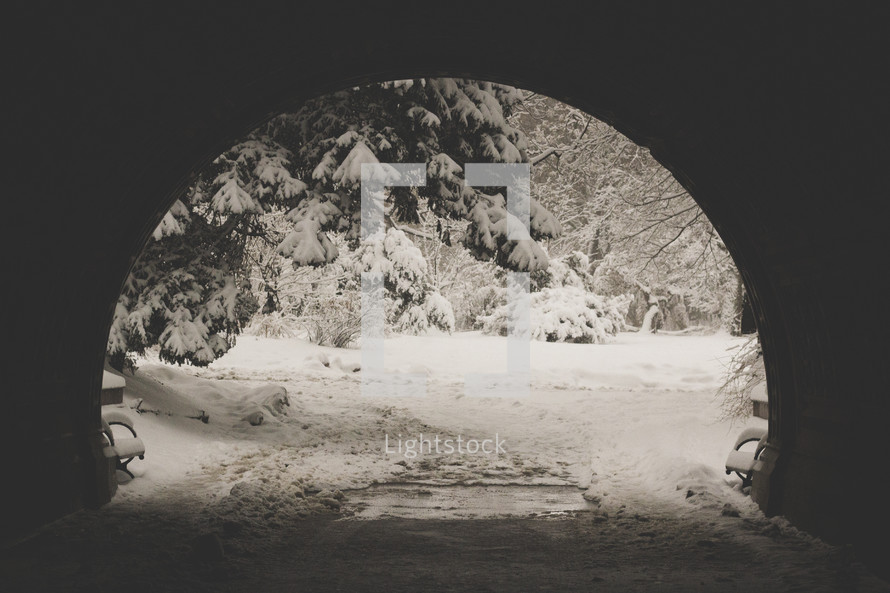 view of snow at the end of a tunnel 
