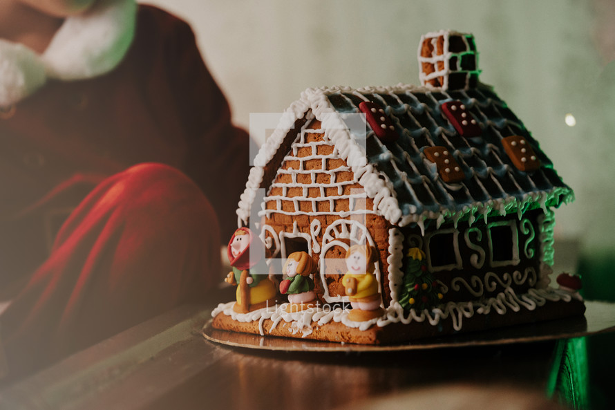 Homemade sweet gingerbread house, decorated cookies. Yummy Christmas dessert. High quality photo