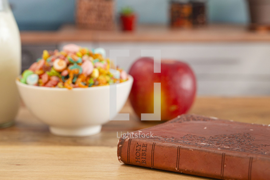 A Bible on a Wooden Table with Breakfast Set a Perfect Way to Start Your Day