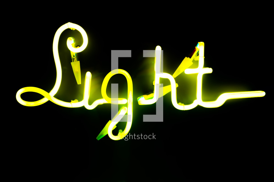  Illuminated letters written light on dark black background. Neon yellow words. Abstract picture. High quality photo
