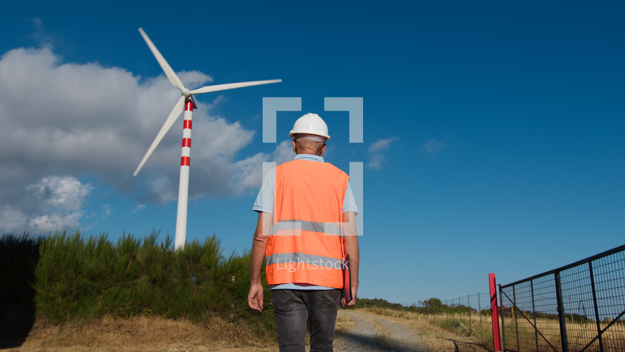 Senior Architect checks the correct functioning of wind turbines