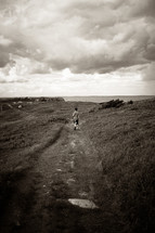 a boy exploring a coastal path 