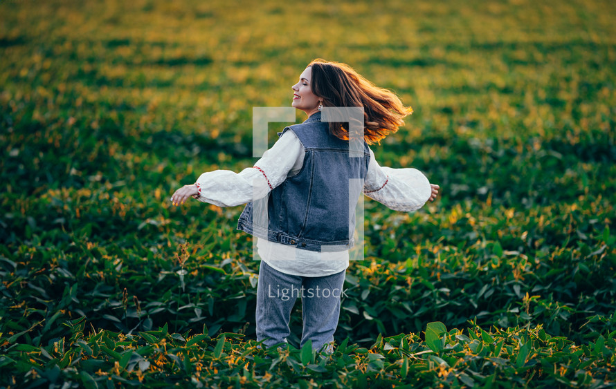 Woman with open up arms to sun. Hands up. Free girl, amazing summer adventure, countryside, rural scene. High quality