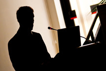 Silhouette businessman during the presentation of of work