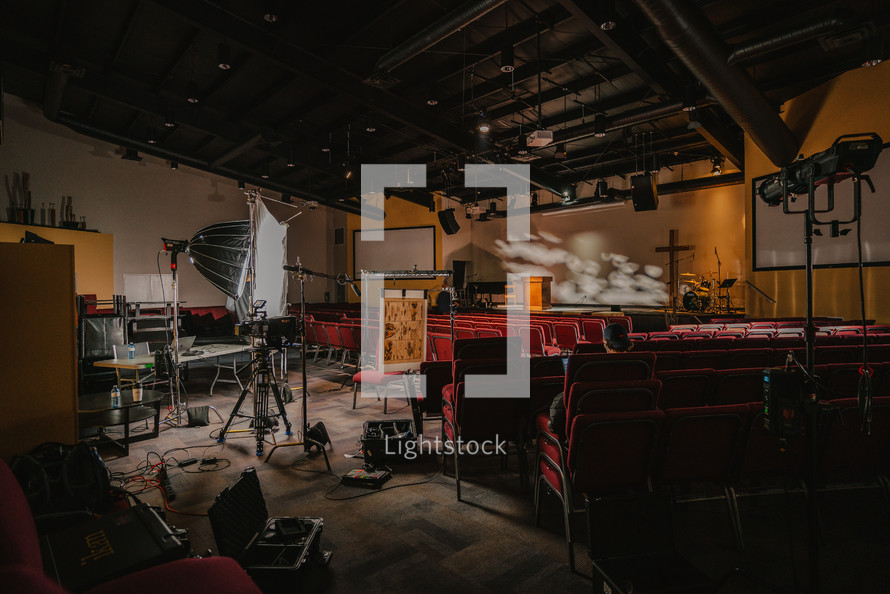 Lights and cameras on church documentary set.