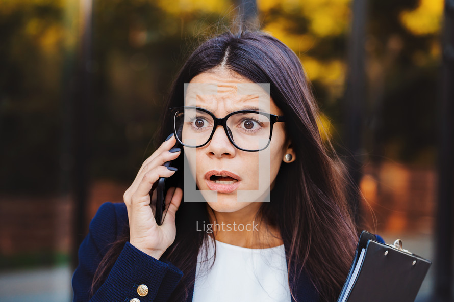 Businesswoman screaming on mobile phone. Having nervous breakdown at work, screaming in anger, stress management, mental distress problems, losing temper, reaction on failure.
