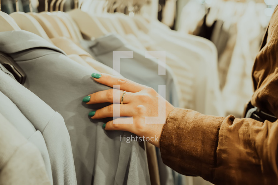 A close up of a woman's hand shopping