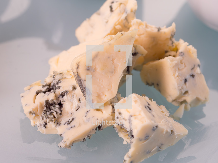 Blue cheese on white isolated background.