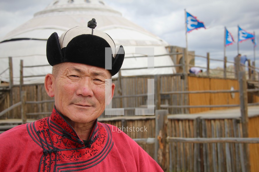 Headshot of a Mongolian man in traditional dress
