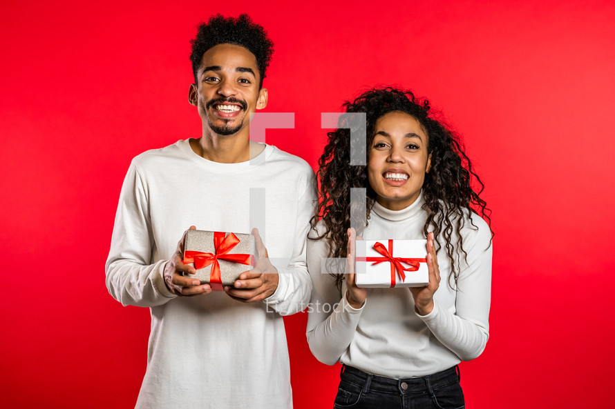 Young African American Couple With Valentines gifts