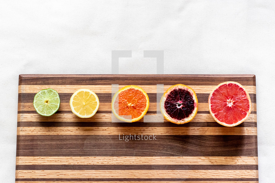 citrus fruit on a cutting board 