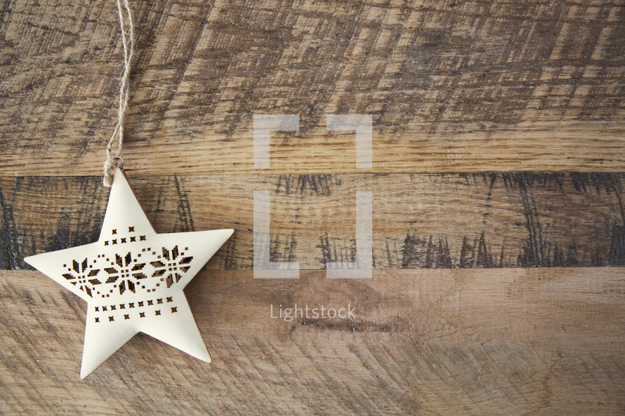 star ornament on wood 