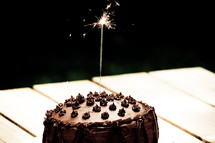 sparkler on a chocolate cake 