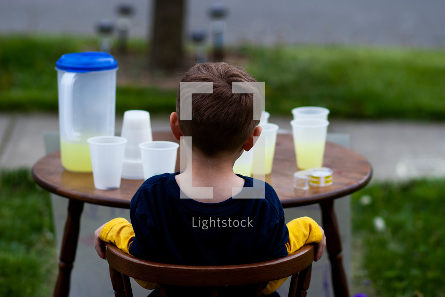 child with a lemonade stand 