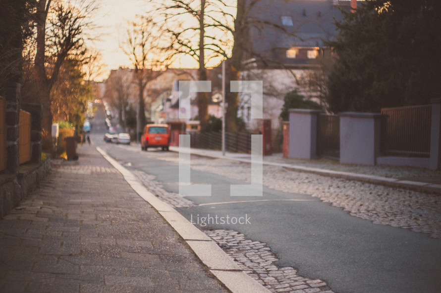 cobblestone street at sunset 