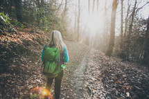 woman backpacking on a nature trail 