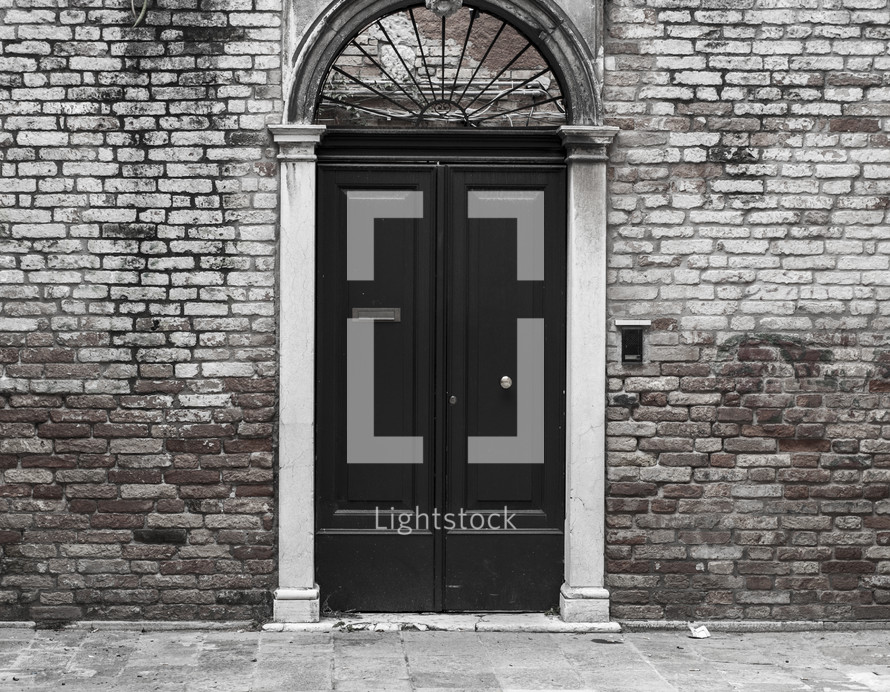 door and entrance to a brick building 