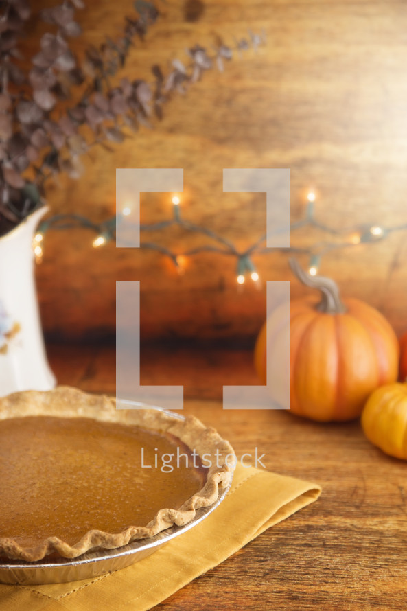 Pumpkin Pie on a Kitchen Counter with Lights