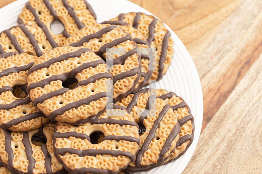 Fudge Striped Shortbreak Cookies on a Wooden Kitchen Table