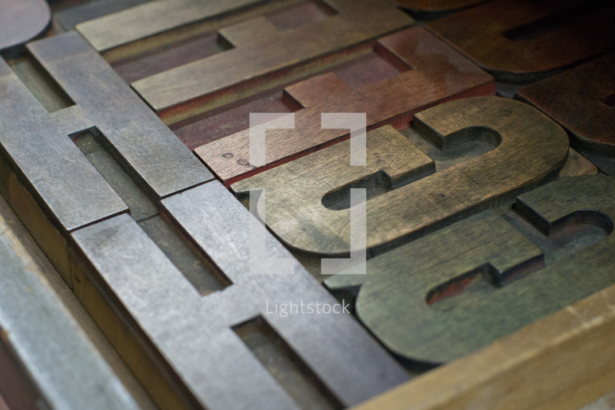 letters on a metal press 