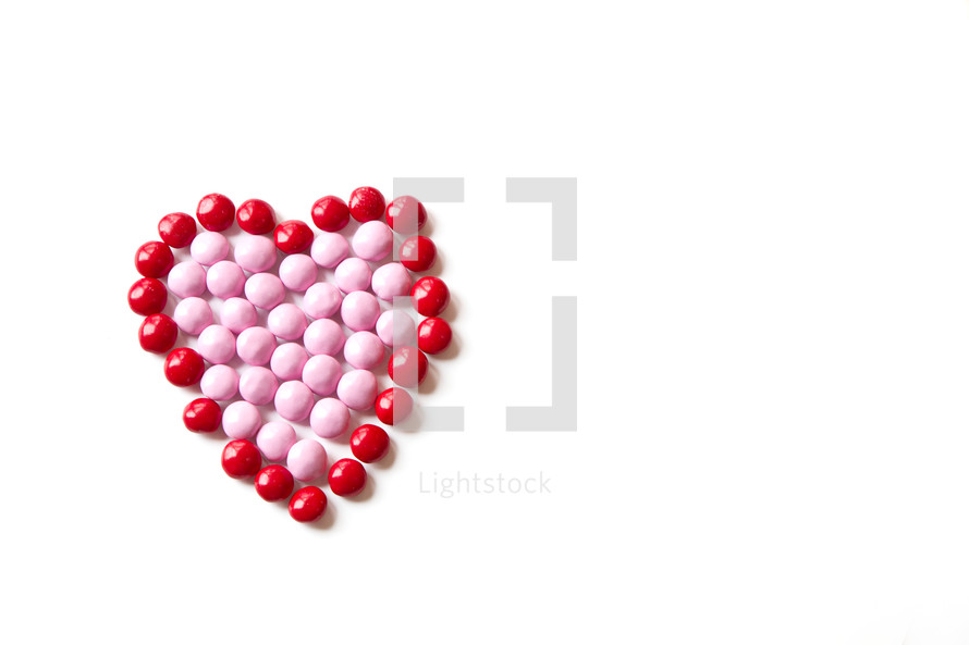 red and pink Valentine's candy in the shape of a heart 
