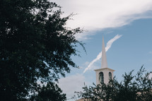white church steeple in a blue sky