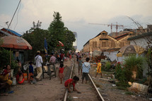 children playing on train tracks 