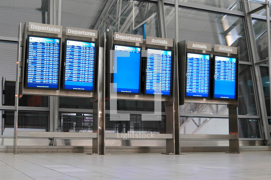 departures and arrivals board at an airport 