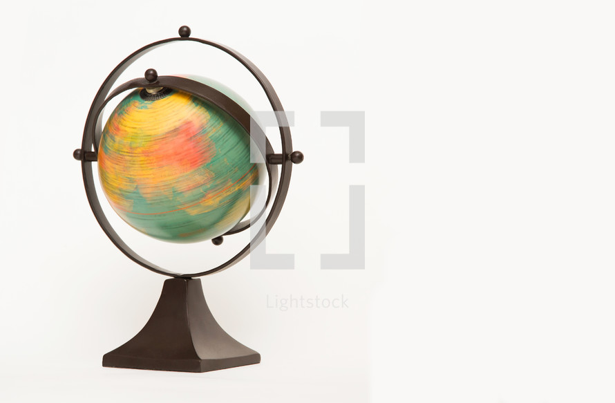 Spinning world globe on a white background