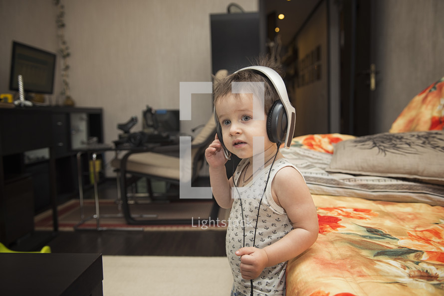 toddler listening to headphones 
