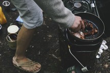 cooking on a camping propane stove 