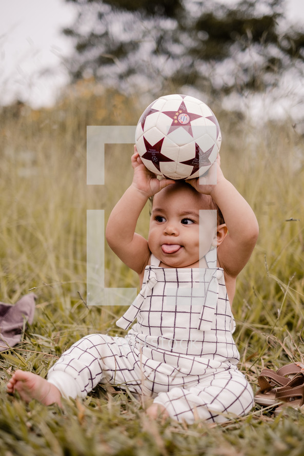 toddler boy with a soccer ball 
